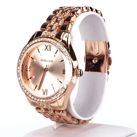 Dámské hodinky Excellanc v barvě růžového zlata s kovovým náramkem, skládací sponou a krystaly.