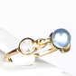 Pozlacený Stříbrný Prsten se Modrá Sladkovodní Perlou a Bílým Topazem